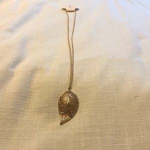 Gold colored long necklace